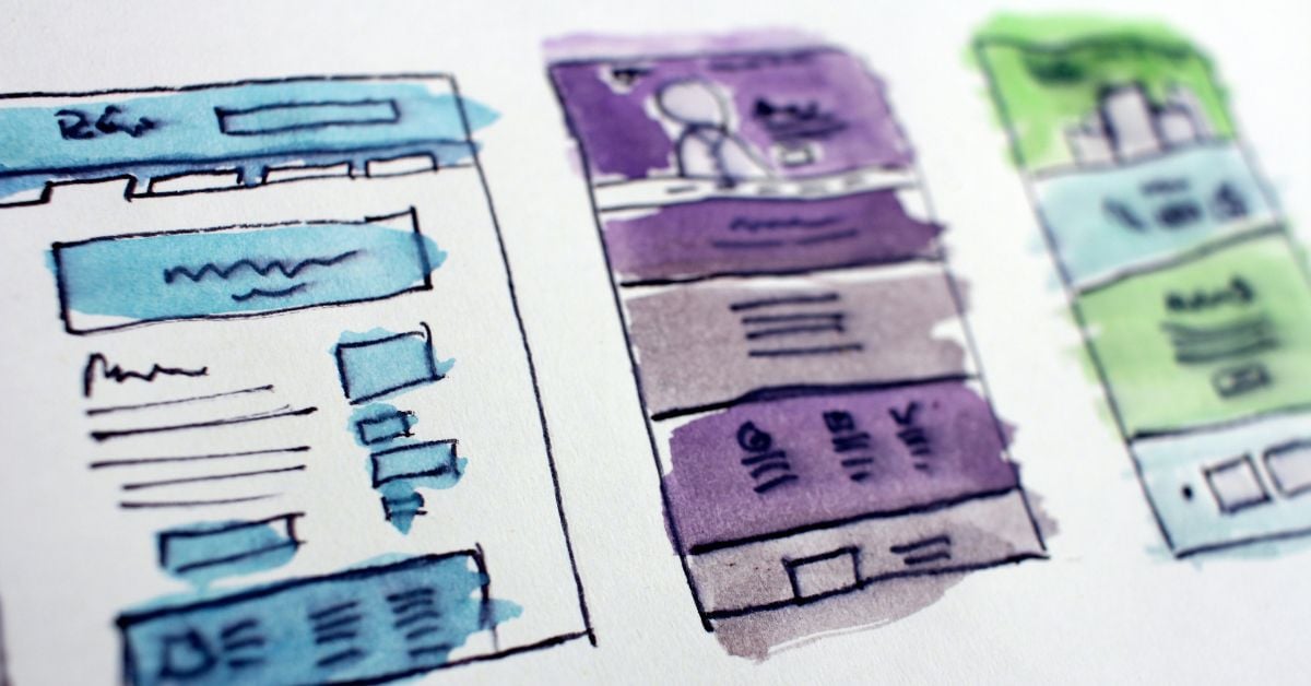 Drawings of landing pages wireframes on a paper